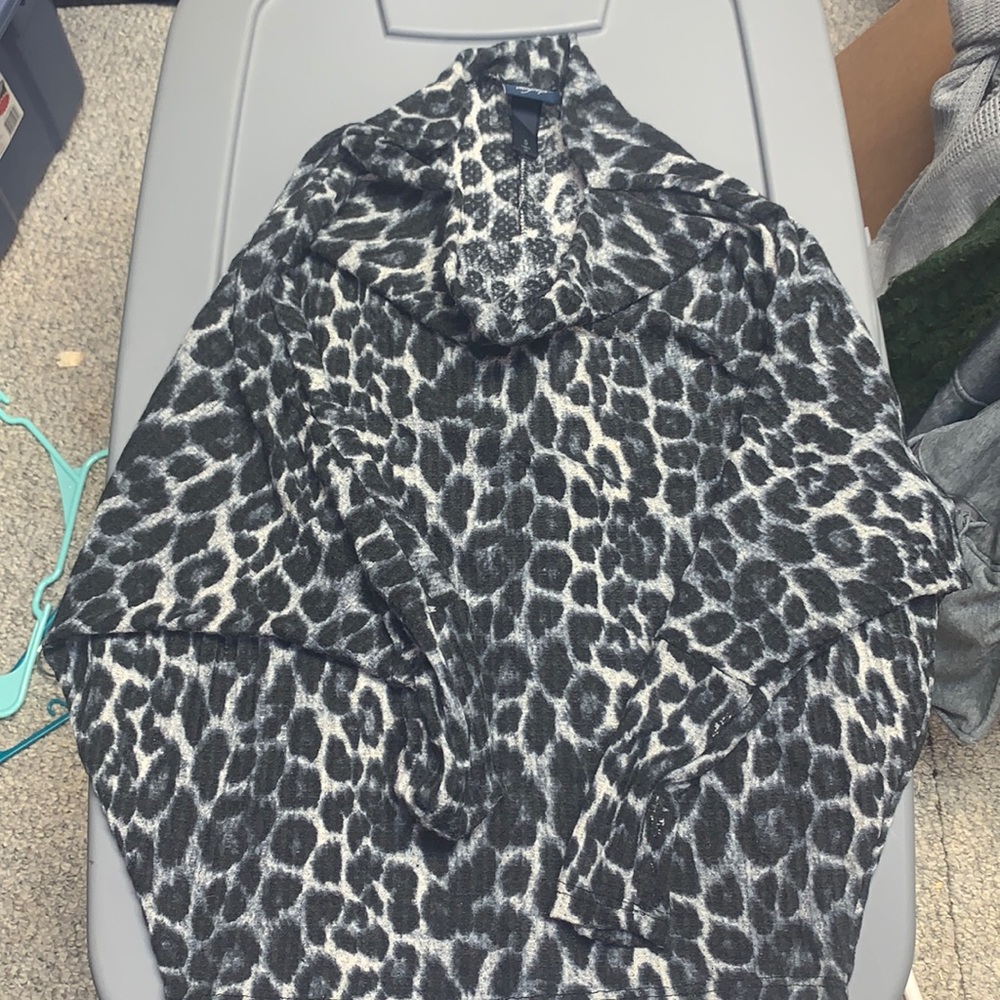 Flows shirt from day trip with dark Cheetah print on it